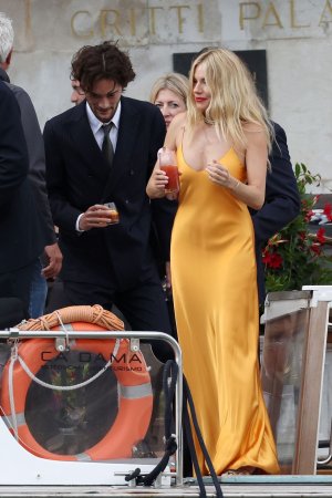 sienna-miller-and-oli-green-at-the-wedding-of-georgia-irwin-and-david-winter-at-la-certosa-isl...jpg