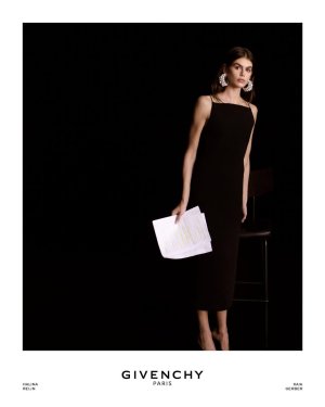 Kaia Gerber wears a sliced square neckline midi kick back dress in cady.Givenchy by Sarah Burton.jpg