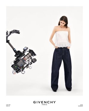 Kaia Gerber wears the cape-back bustier peplum top in Givenchy lily of the valley chantilly lace.jpg