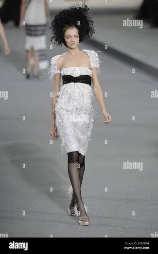 a-model-displays-a-creation-by-designer-karl-lagerfeld-for-chanel-house-spring-summer-2009-re...webp