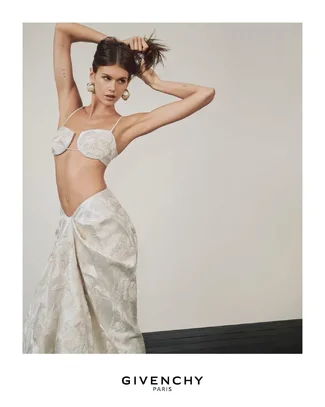 Kaia wears the cutaway bra and bed sheet skirt in calico silk satin duchesse with pink iris s...webp