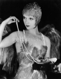 1929 in costume for her role in The Canary Murder Case.jpg