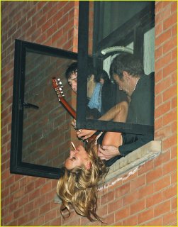 kate-moss-hanging-out-window-01.jpg