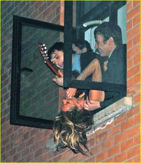 kate-moss-hanging-out-window-03.jpg