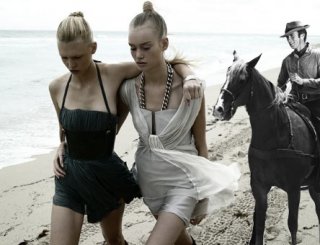 clint and models on the beach.jpg