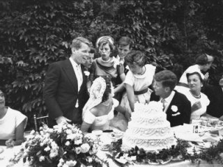 239670~Senator-John-F-Kennedy-with-His-Bride-Jacqueline-at-Their-Wedding-Reception-Posters.jpg