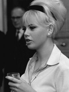 GL556719~Actress-Britt-Ekland-Holding-a-Wine-Glass-Deep-in-Conversation-c-1960-Posters.jpg