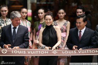 Gong Li Yves Carcelle CEO   Louis Vuitton Shanghai ribbon.jpg